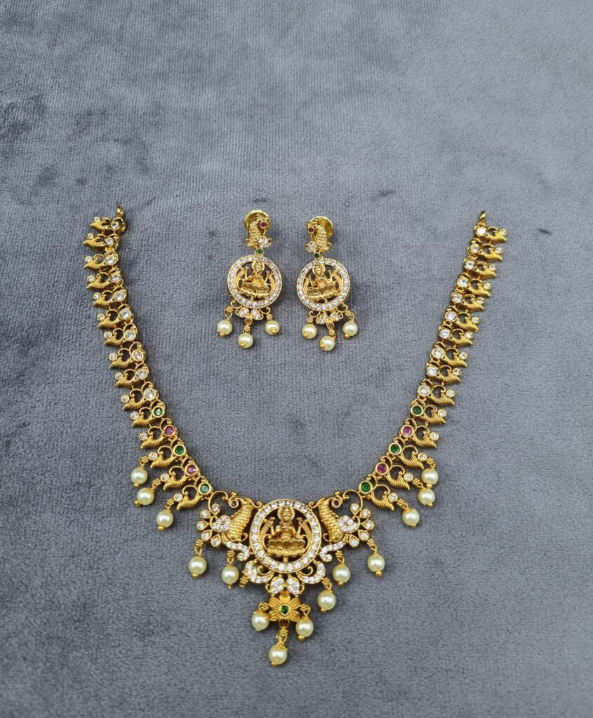 Ornate Goddess Necklace in Gold Plated with Pearls | Bridal Jewellery India